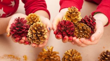 children-holding-painted-pine-cones | Creative Pine Cone Crafts For Kids | Featured