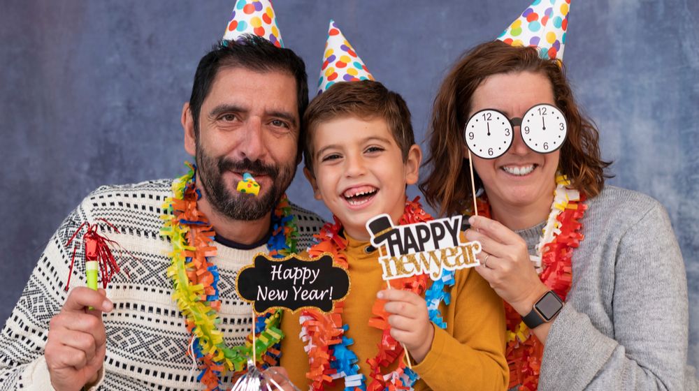 happy-family-celebrating-new-years-eve | 13 New Year’s Eve Crafts That Are Easy And Fun To Create | Featured