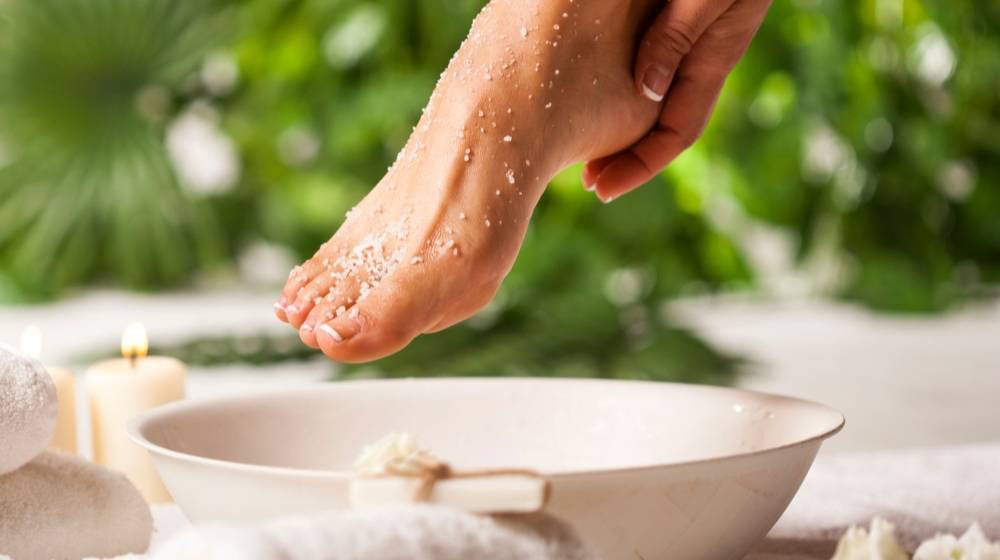 female-feet-sea-salt-on-white | DIY Foot Peel Recipes For Dry And Cracked Feet | Featured