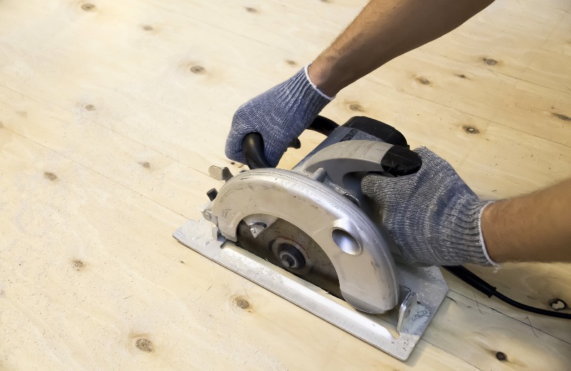 Man's Gloved Hands Working With a Circular Saw | DIY Table Saw
