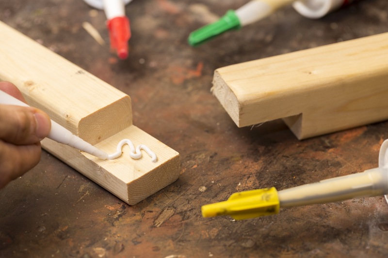 Putting Glue on a Piece of Wood | DIY Kayak Rack