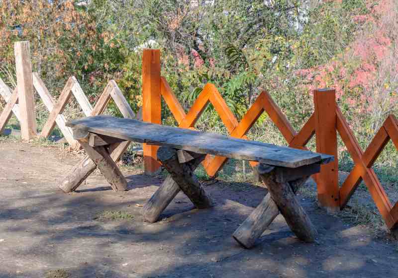 Bench and fence made of wooden logs | DIY X-Brace Bench