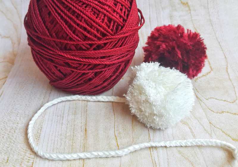 bookmarks made of red and white wool yarn | Yarn Ball Bookmarks