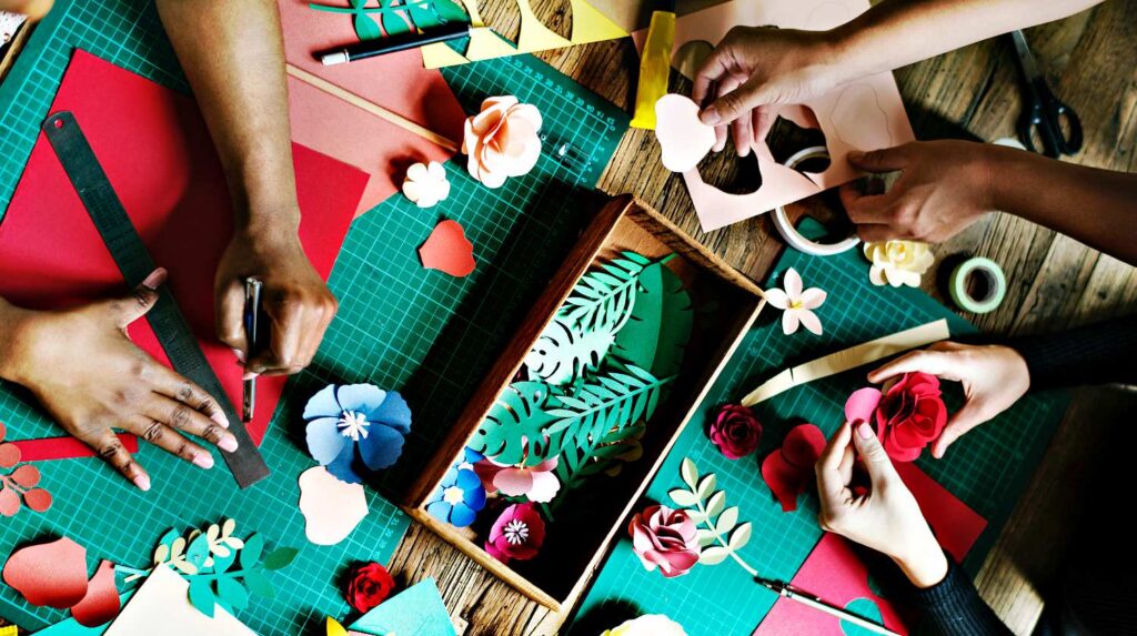 Feature | Three people doing papercrafting | Fun Summer DIY Projects For The Whole Family
