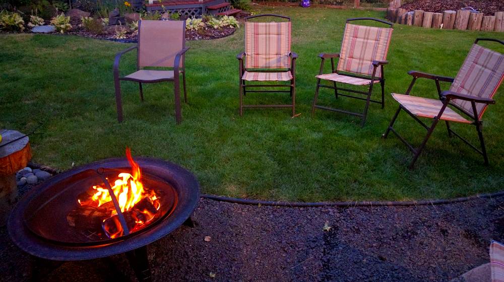 backyard fire pit chairs summer 1825423 | DIY Propane Fire Pit For Chill Evenings | Featured