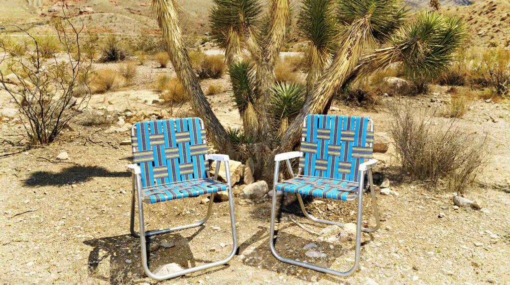 Featured | Empty plaid lawn chairs in desert landscape | How To Make A Macrame Lawn Chair | DIY Projects