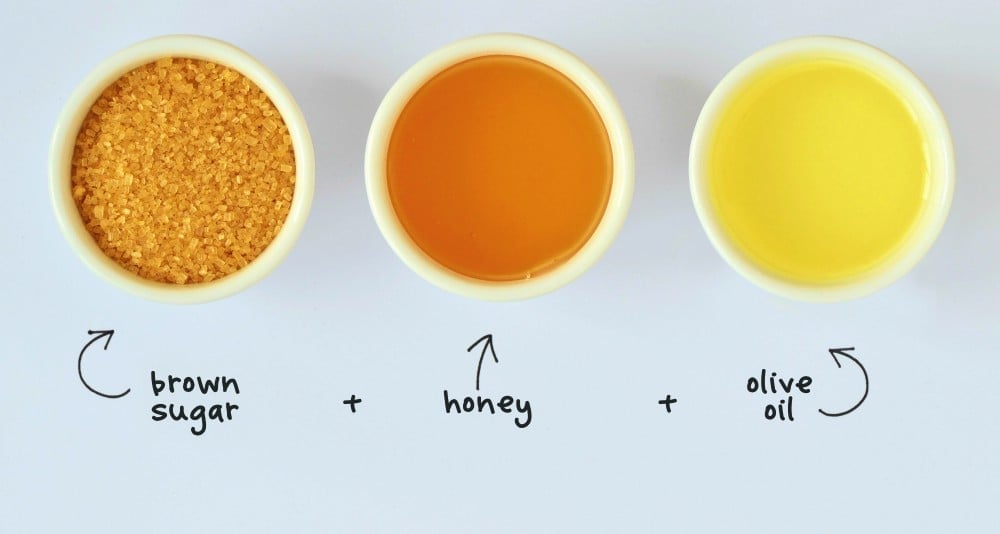 Homemade foot scrub made out of brown sugar, honey and olive oil - White background | DIY Foot Scrub Recipe For Your Own Home Spa