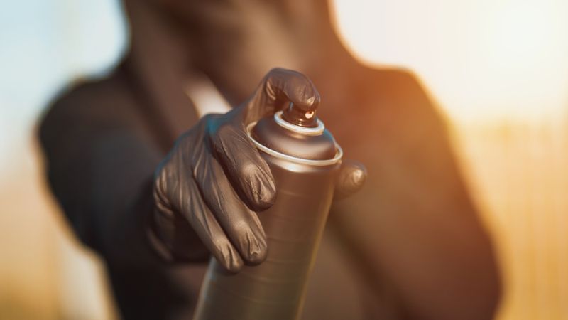 man-mask-gloves-holding-spray-can | car rack