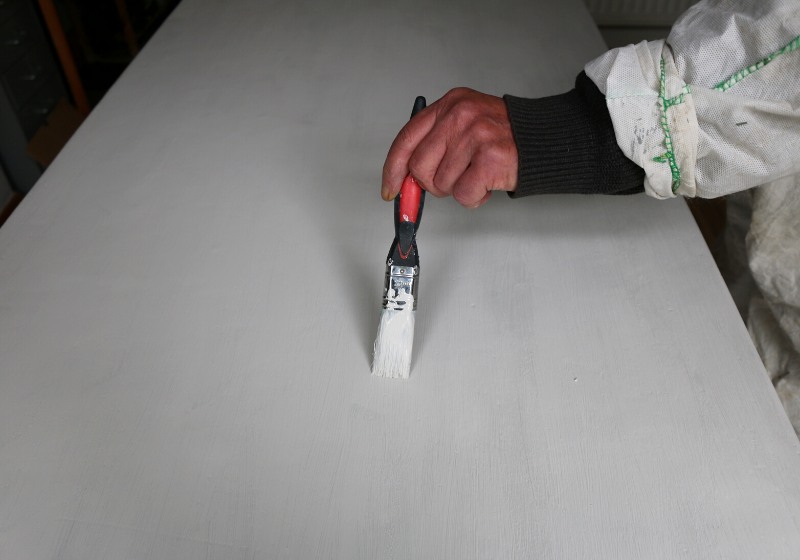 man painting dining table grey paint | folding workbench garage