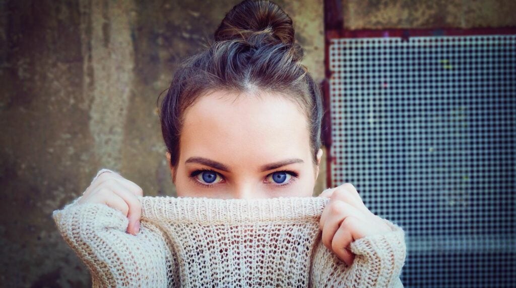 Feature | Girl blue eyes holding her knitted sweater | DIY Clothes | Tops, Tees, And Blouses Edition