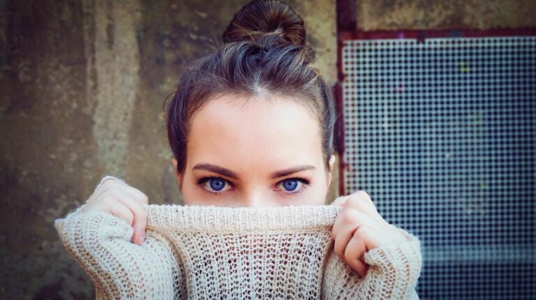 Feature | Girl blue eyes holding her knitted sweater | DIY Clothes | Tops, Tees, And Blouses Edition