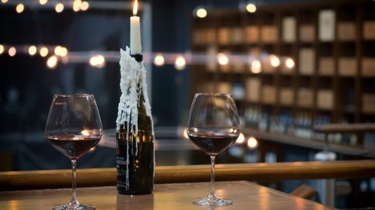 two-glasses-red-wine-on-table | DIY Wine Bottle Candle Holder | Featured
