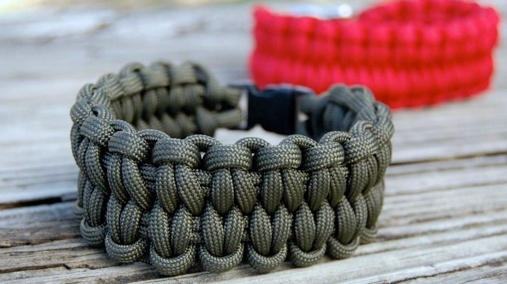 two paracord bracelets on the table | How To Make A Paracord Bracelet: Blaze Bar Quick Deploy | how to make a paracord bracelet | how to make a paracord bracelet step by step | Featured
