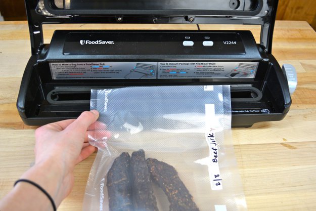 Place the open end in the vacuum sealer.