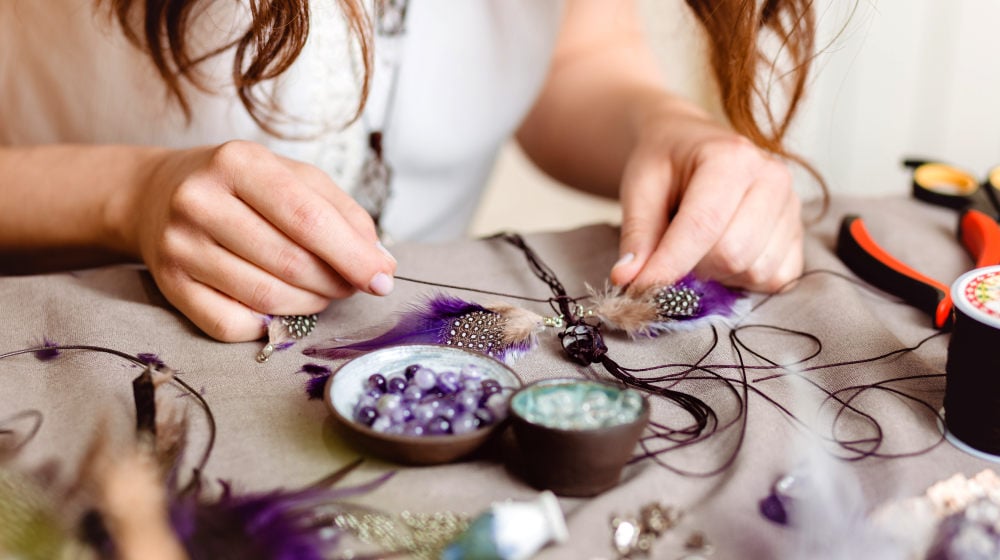 Woman making handmade gemstone with feather jewelry | Feather Craft Ideas To Make At Home | feather craft ideas | Featured