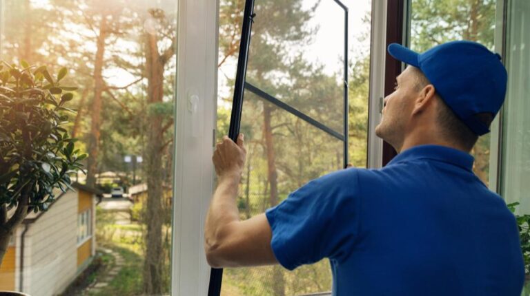 worker-installing-mosquito-net-wire-screen | Learn How To Repair A Window Screen Like A Pro! | Featured