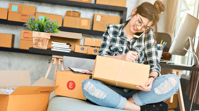 Featured | Young entrepreneur business owner work at home phone call receive from customer and white down address for deliver | College Care Package Ideas