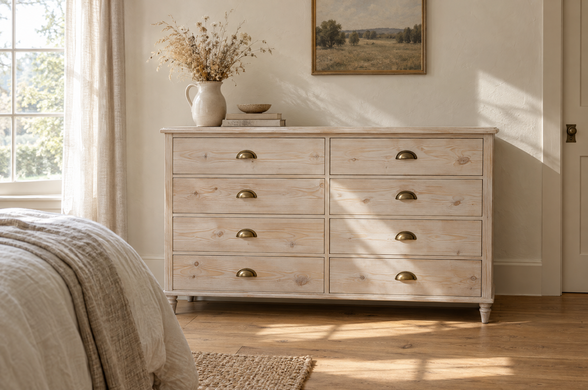 How to whitewash furniture: whitewashed pine dresser with brass pulls in a sunny bedroom