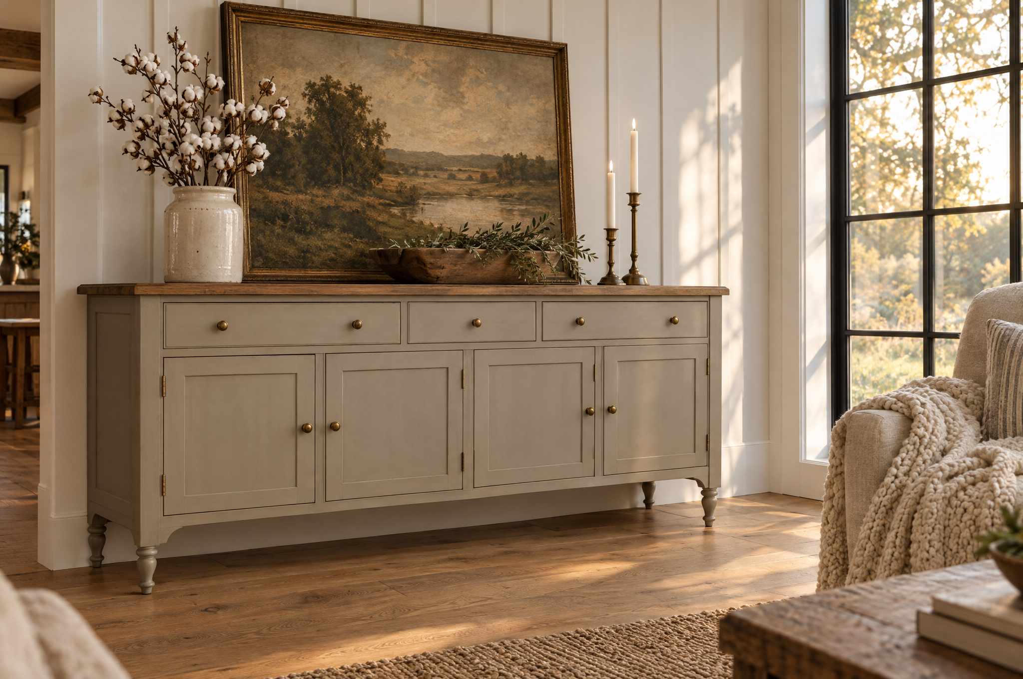 Refinished greige sideboard with a wood top styled in a farmhouse living room